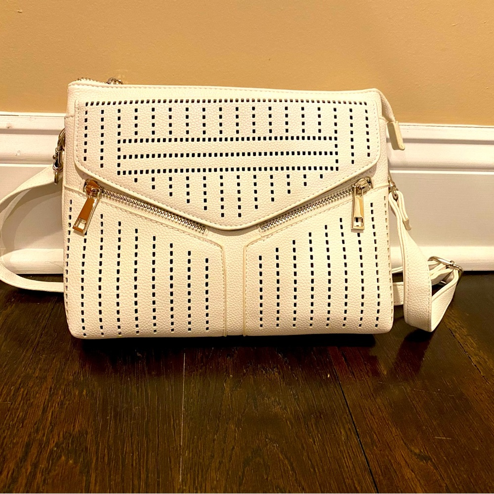 Genuine leather perforated crossbody bag with double zip pockets